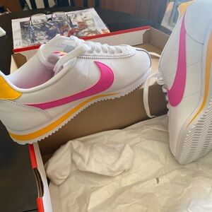 Nike Women's White and Pink Athletic Shoes with Yellow Accents